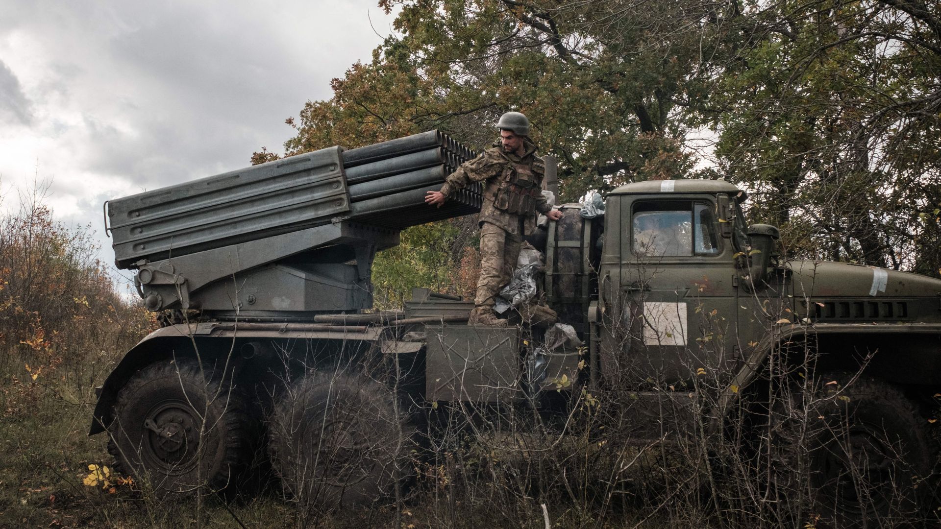Ukrainian soldiers prepare to move their multiple rocket launcher