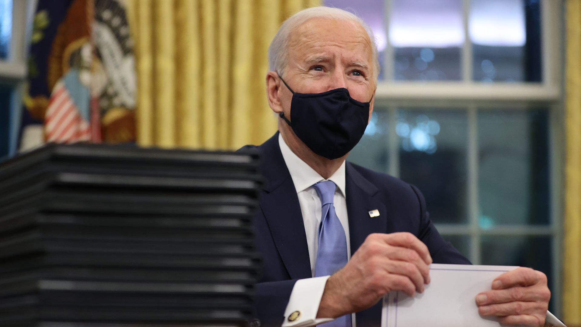 President Biden signs executive orders in the Oval Office