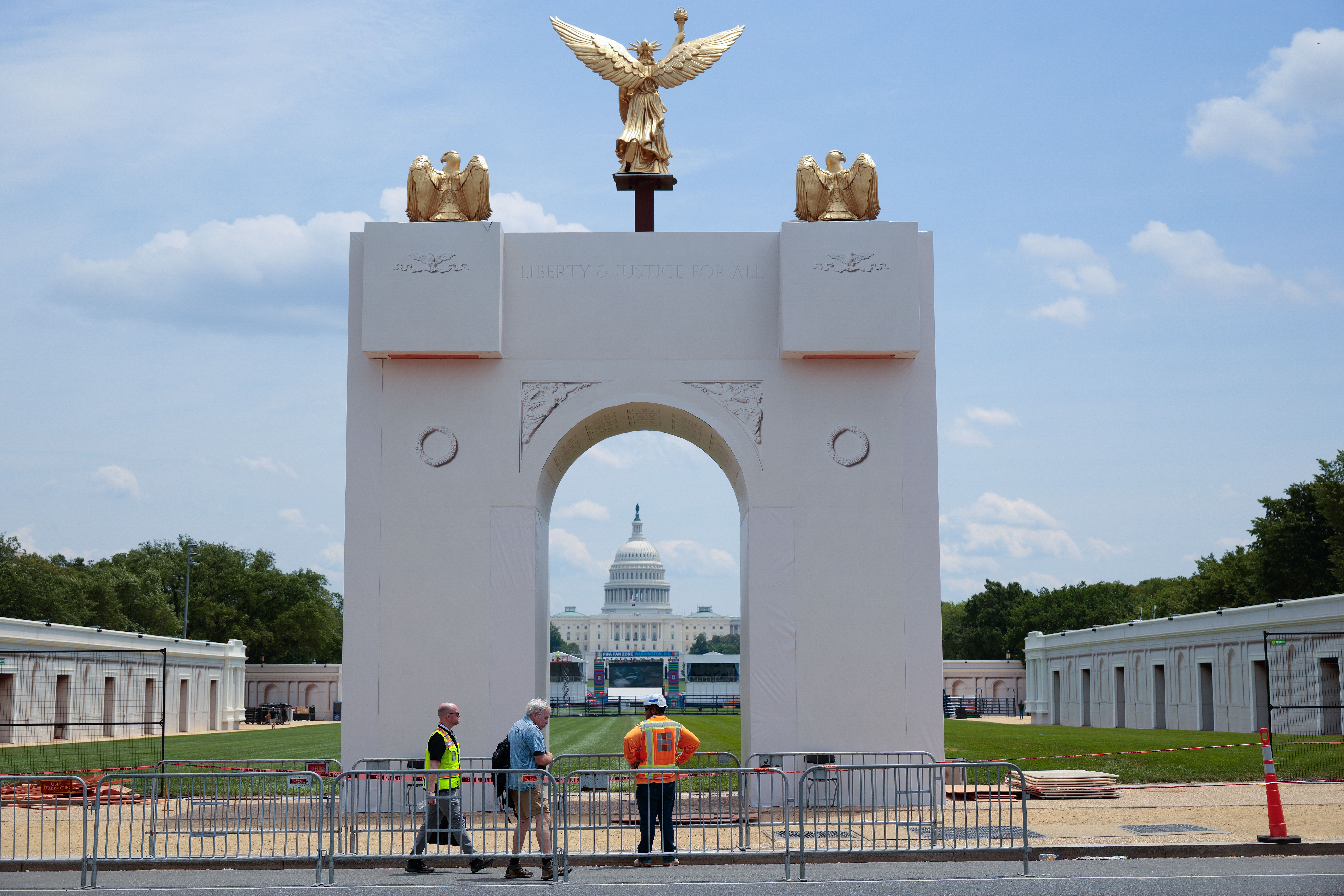 A replica of President Trump's proposed 250-foot arch, temporarily constructed on the National Mall, viewed here with the U.S. Capitol in the background