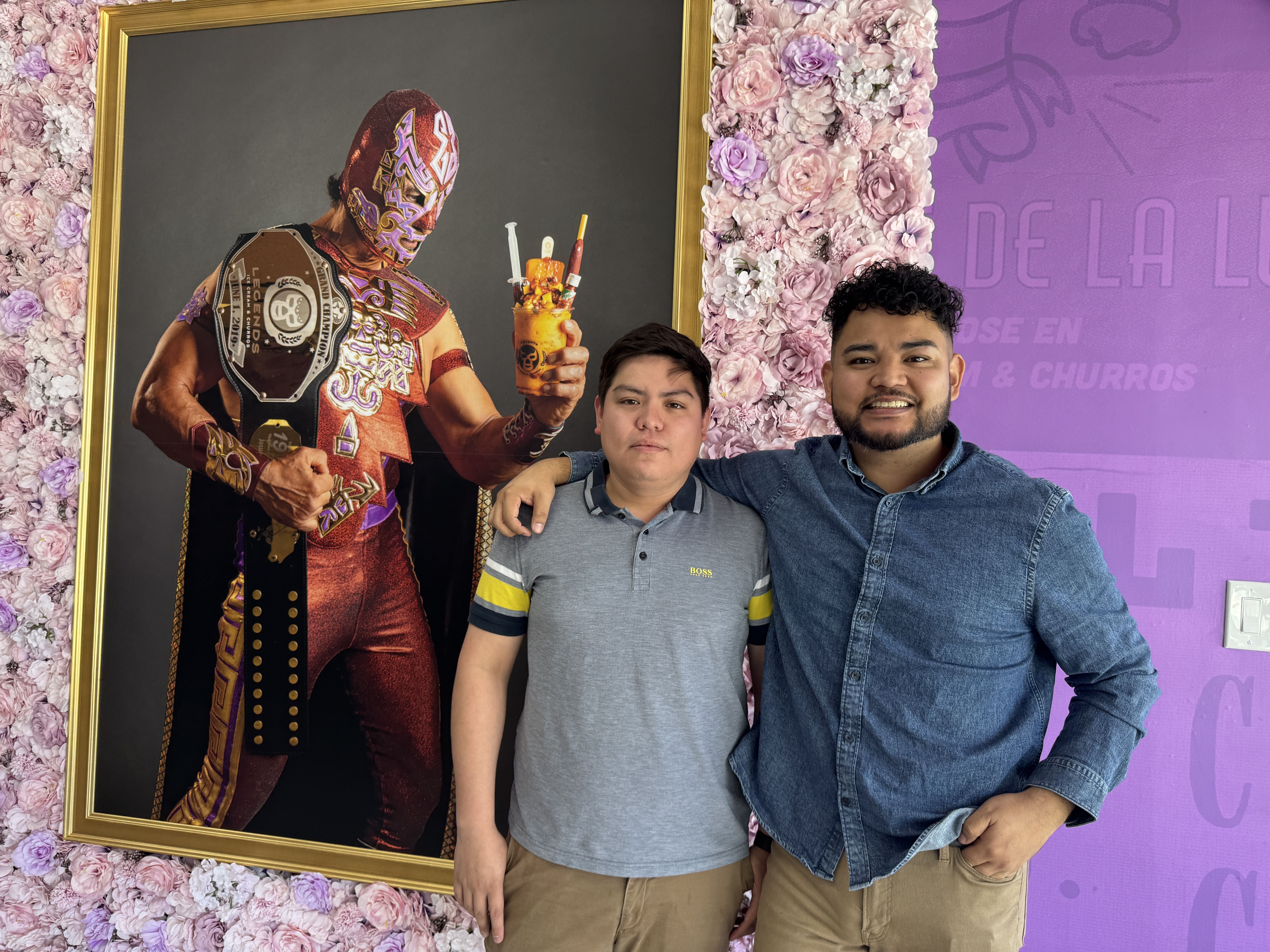 two people smiling at the camera