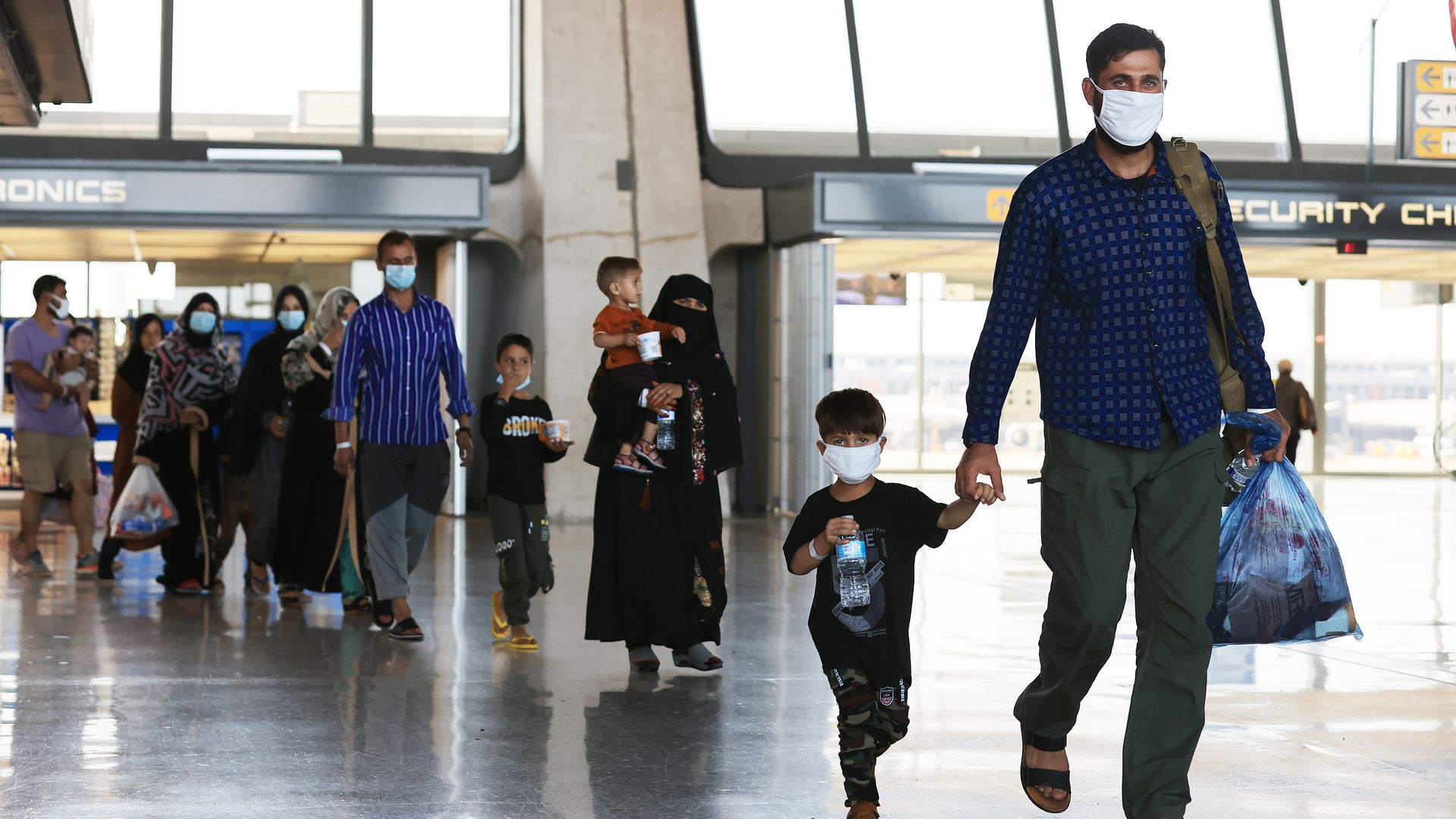 Refugees arrive at Dulles International Airport