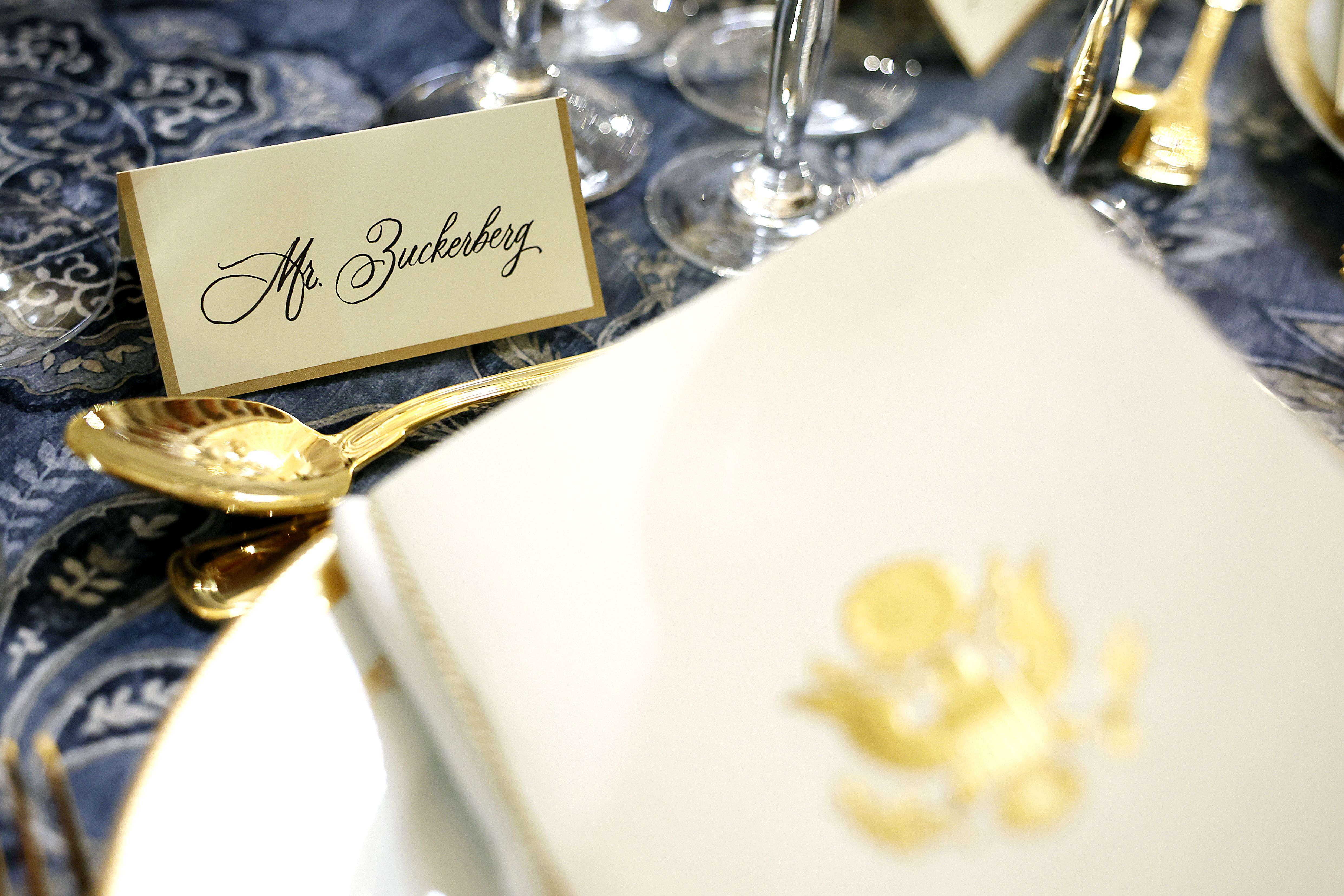 A gold trimmed name tag for Mr Zuckerberg at an inauguration luncheon