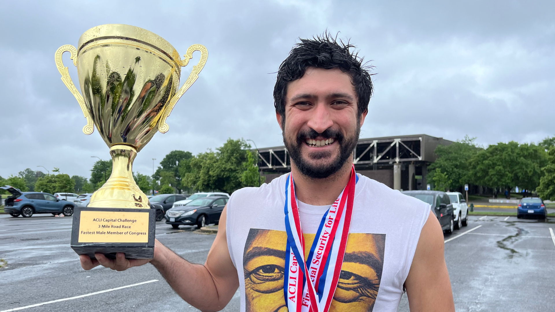 Congressman Greg Casar holding a trophy.