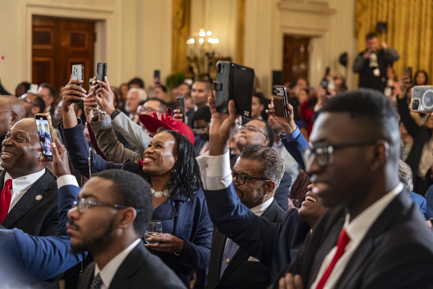Black Trump supporters gather as President Trump delivers remarks during a reception in the East Room of the White House on Feb. 18. 2026.