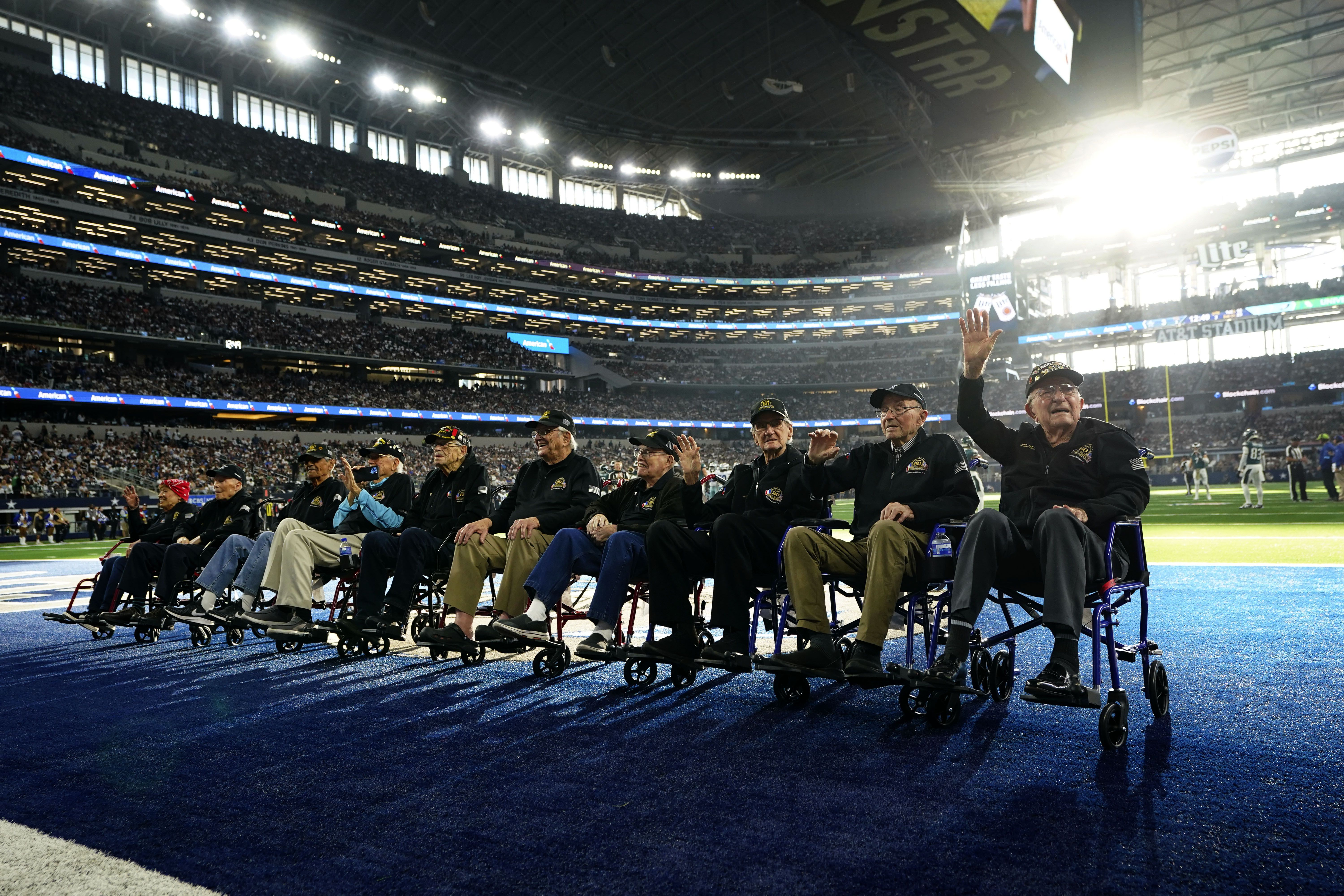 Veterans of World War II are celebrated during the first half of an NFL football game between the Philadelphia Eagles and Dallas Cowboys at AT&T Atadium in Arlington, Texas, Sunday, Nov. 10, 2024. 