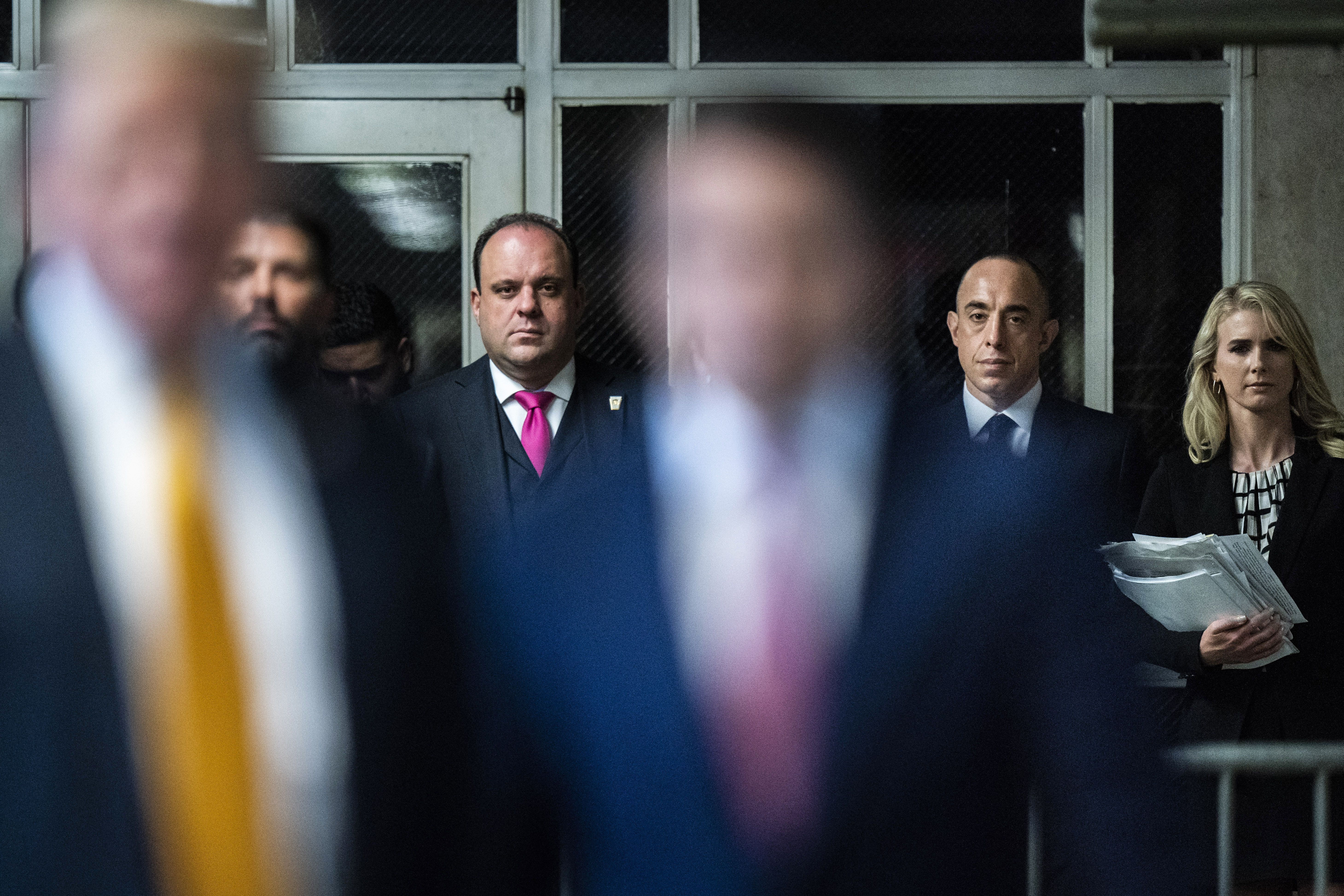 Boris Epshteyn listens as former President Trump speaks to reporters at his New York criminal trial in May.