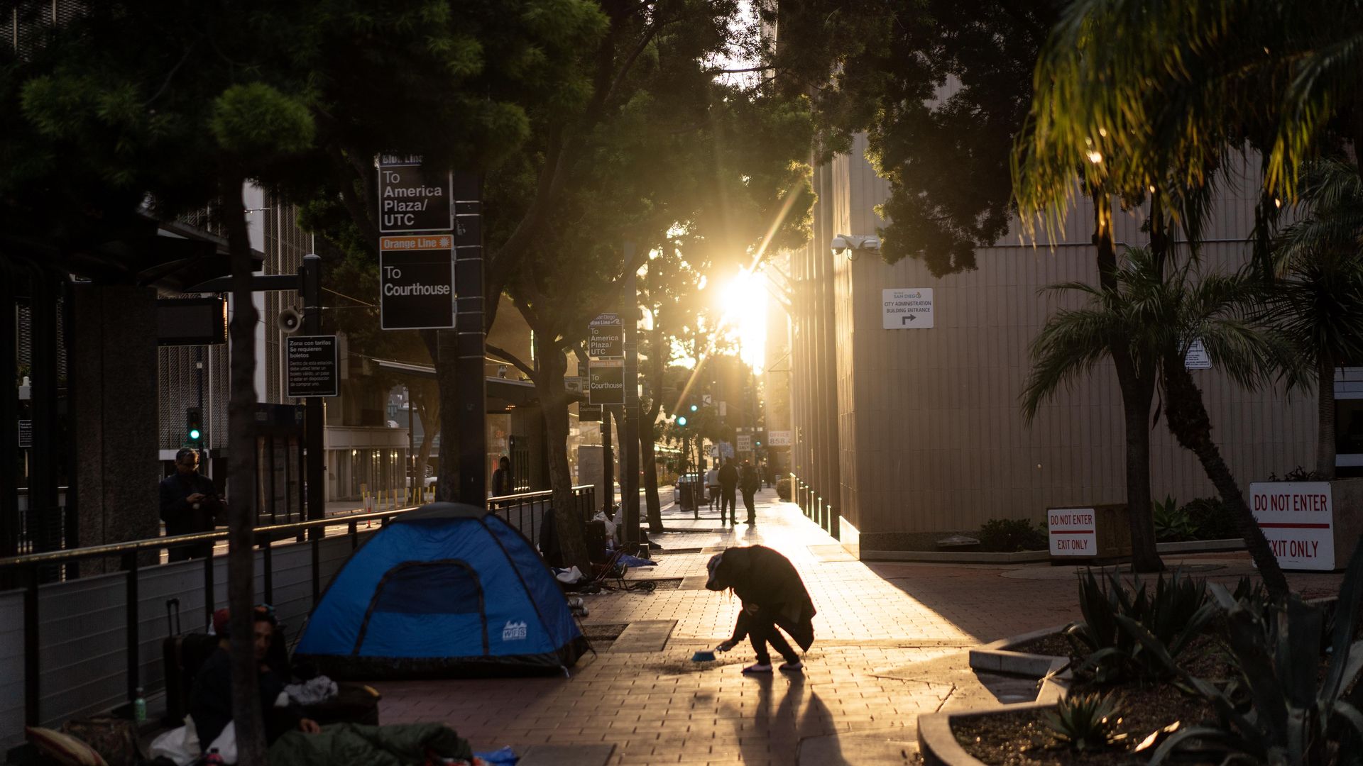 The sun sets on a homeless encampment in downtown San Diego