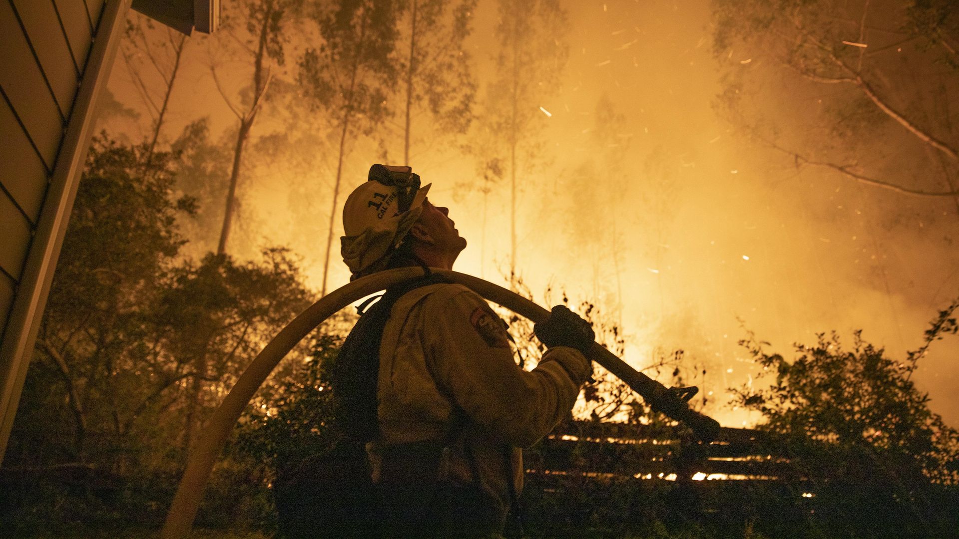  A firefighter tries to put out the wildfire on August 19, 2020 in San Mateo, California.