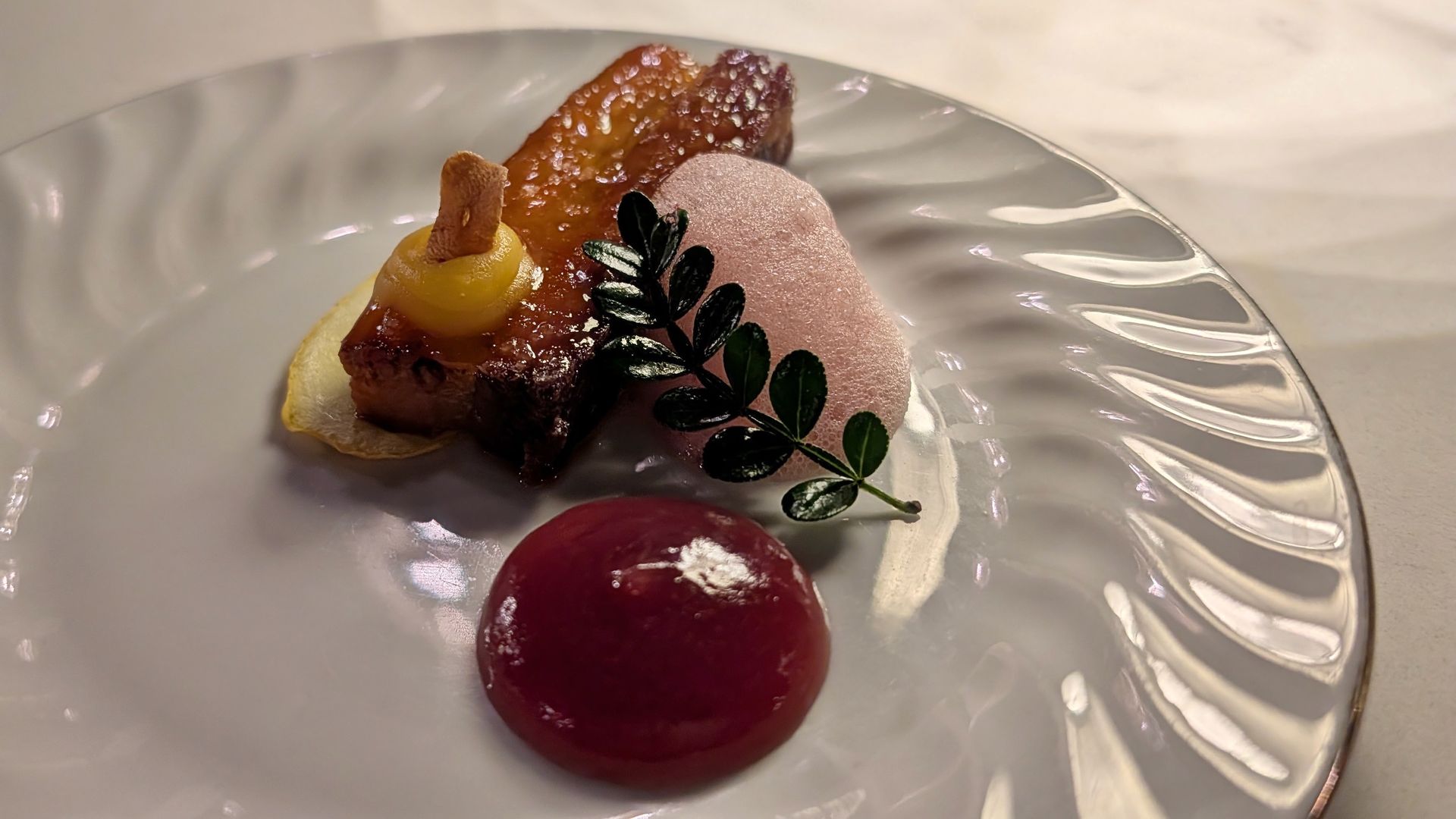 A piece of pork belly with other ingredients
