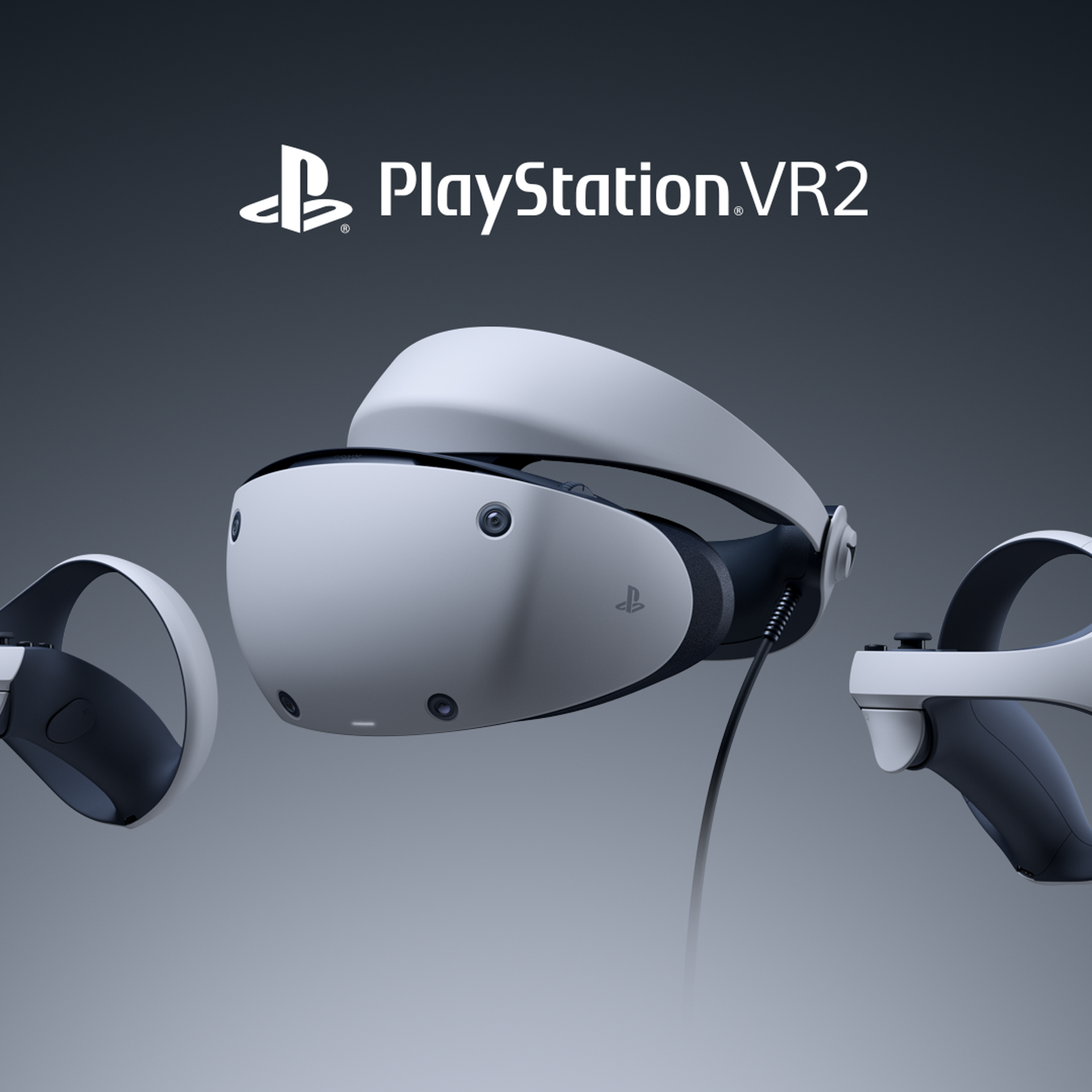 Photo of the PSVR2 headset and its two controllers in front of a gray background