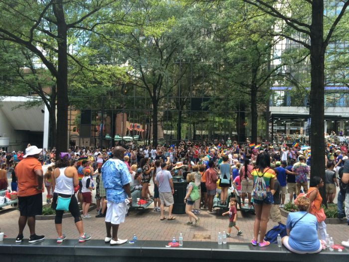 Crowds gather along Trade Street