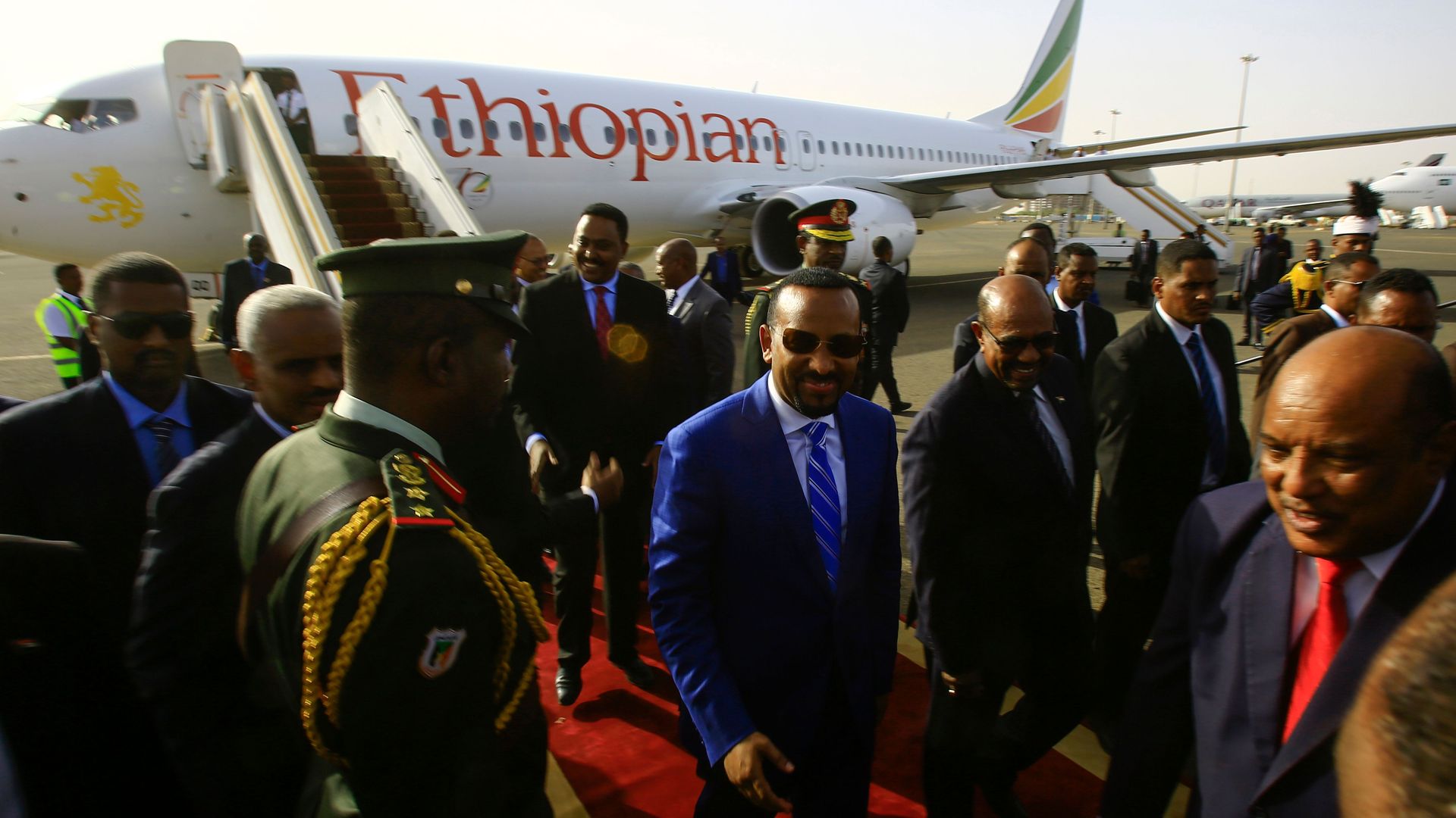 Ethiopian Prime Minister Abiy Ahmed is welcomed by Sudanese President Omar al-Bashir following his arrival in Khartoum for an official visit to Sudan on May 2, 2018.