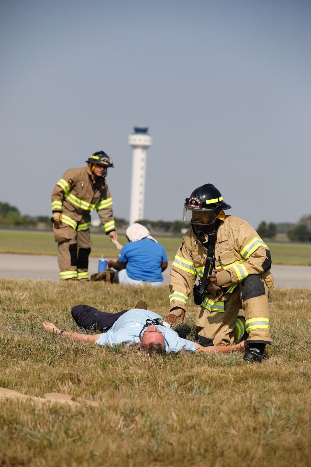 Firefighters attend people during an exercise at Huntsville International Airport. 