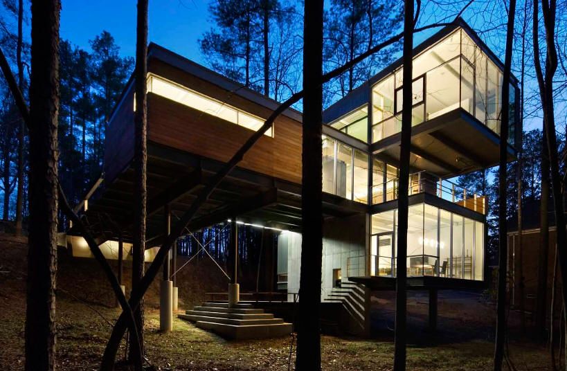 A modernist home, with two square rooms floating off the main portion of the house. 