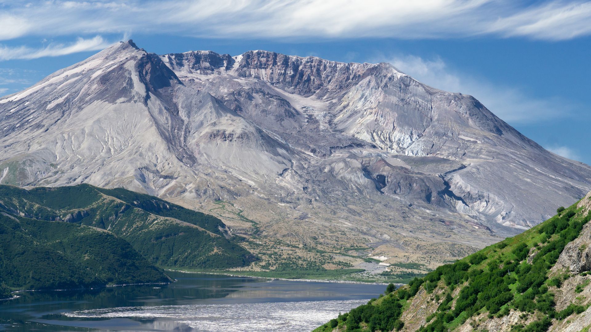 A wide landscape shot shows Mount St. Helens south side with the collapsed crated left by its eruption in 1980.