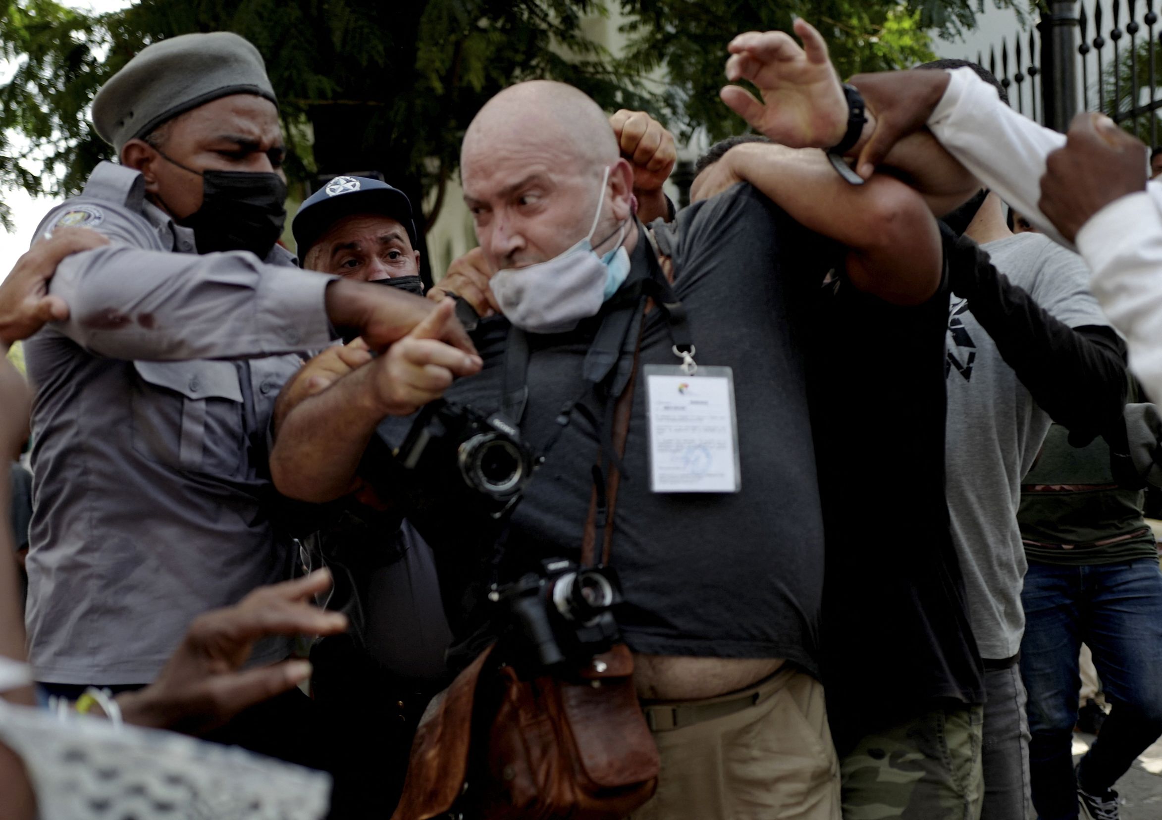 AP photographer, Spanish Ramon Espinosa, is attacked by the police while covering a demonstration against Cuban President Miguel Diaz-Canel in Havana, on July 11