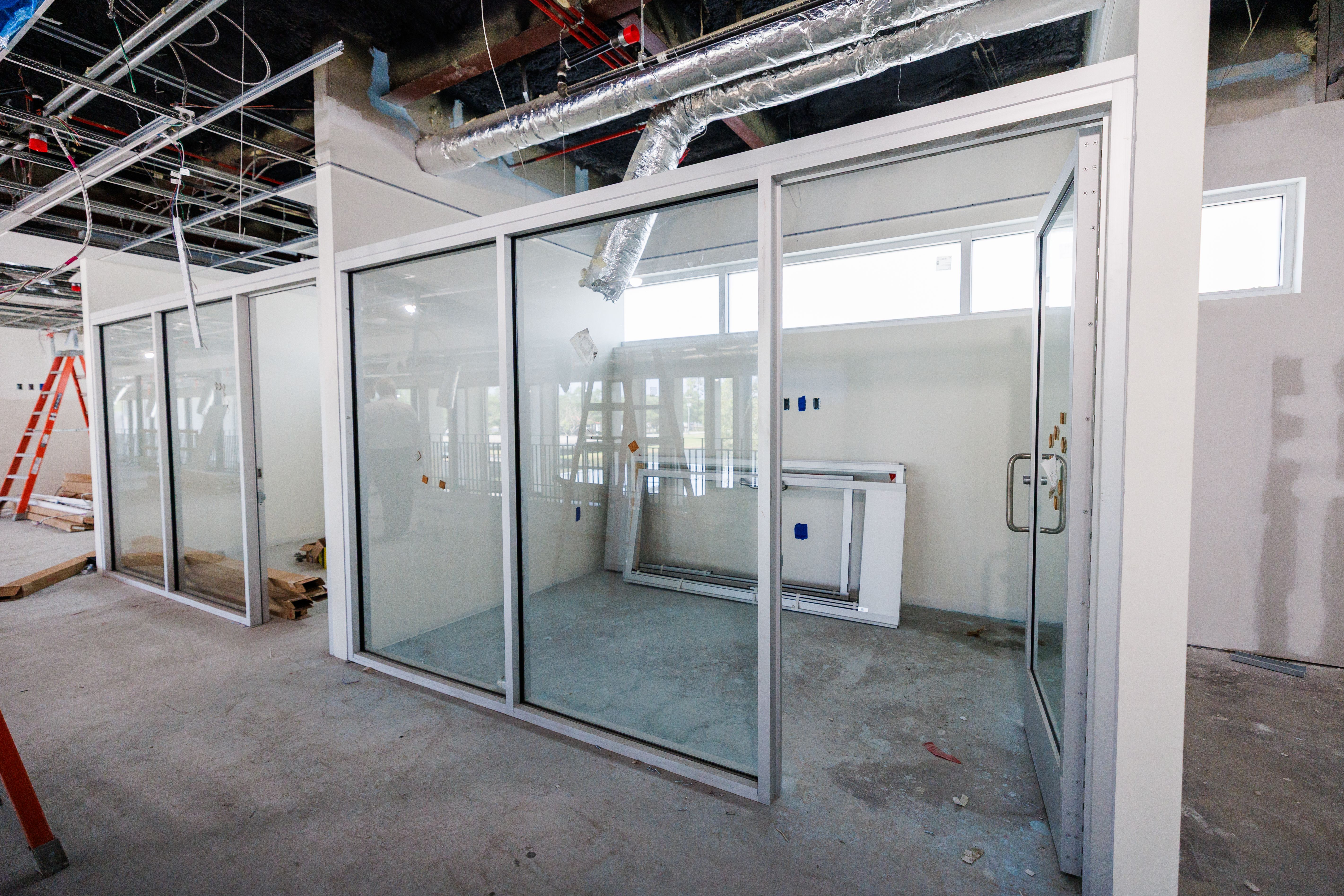 Private offices with glass walls and doors.