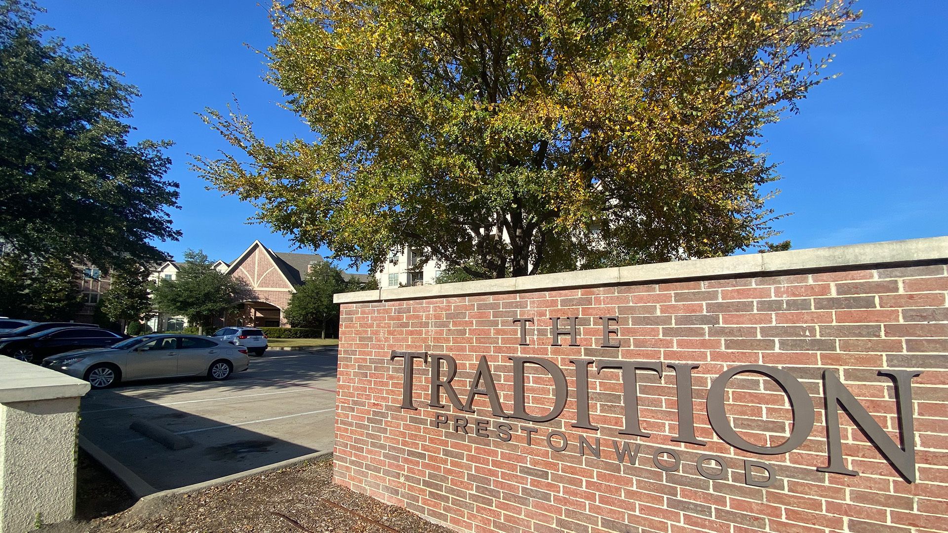 A brick sign that reads THE TRADITION