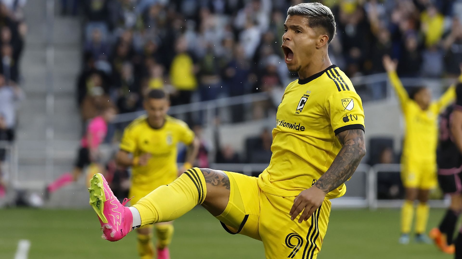 Cucho Hernandez kicks his leg in the air after scoring a goal.