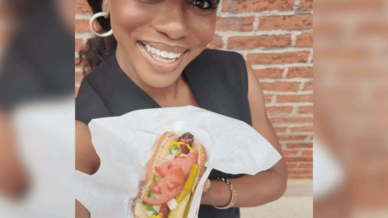 Moyo Adeolu with a Chicago style hot dog. 