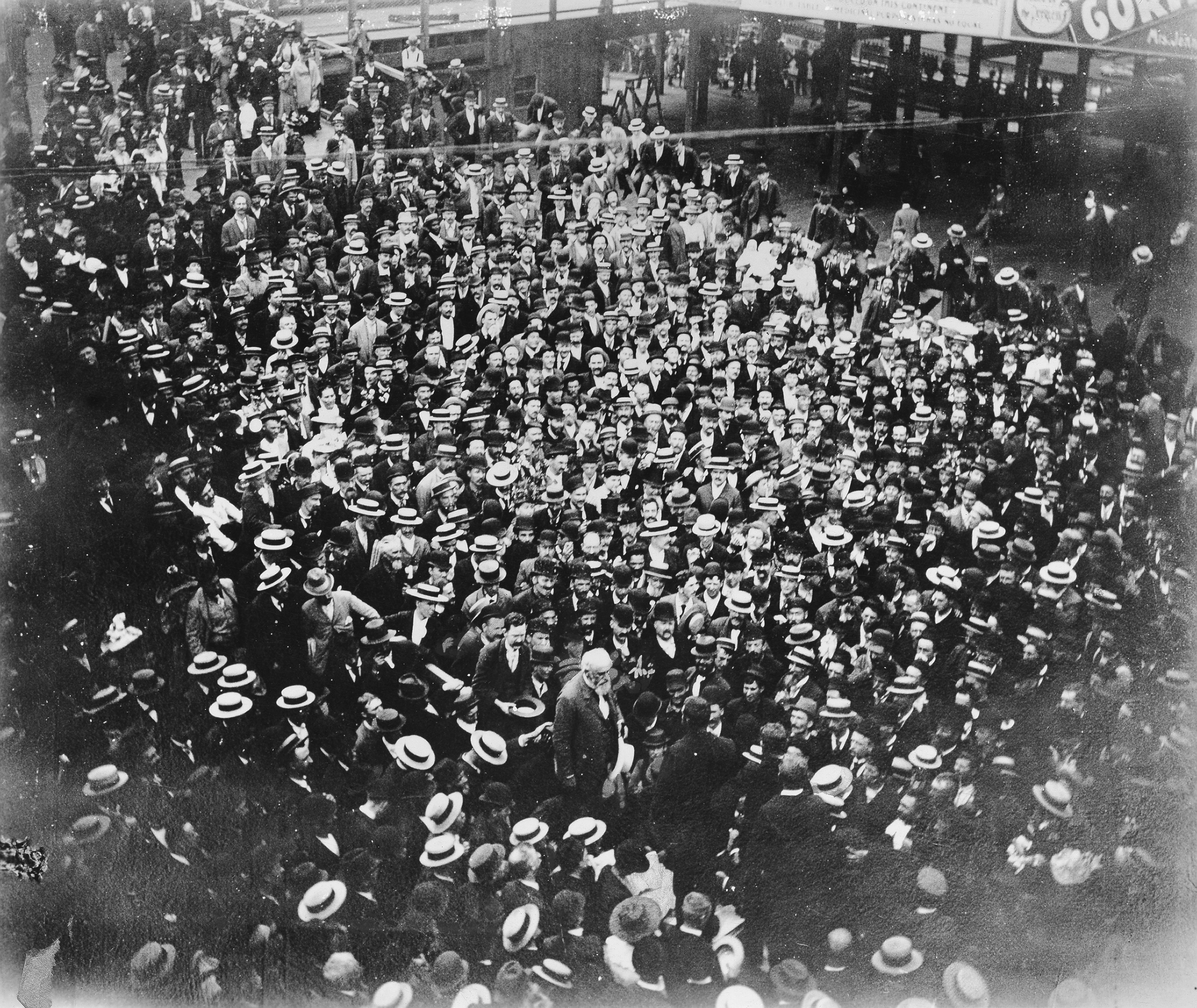 Photo of a crowd listening to a speech from a politician