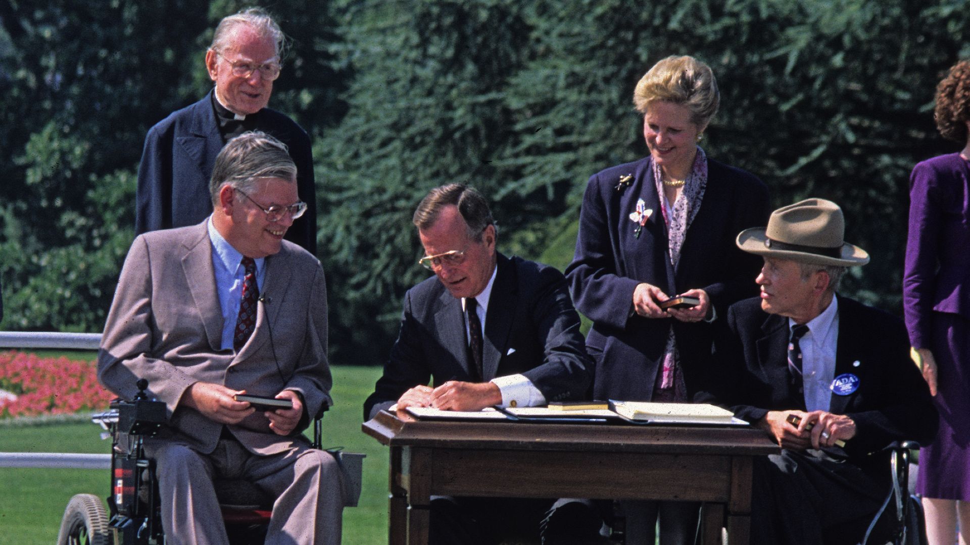 George HW Bush signing the ADA into law