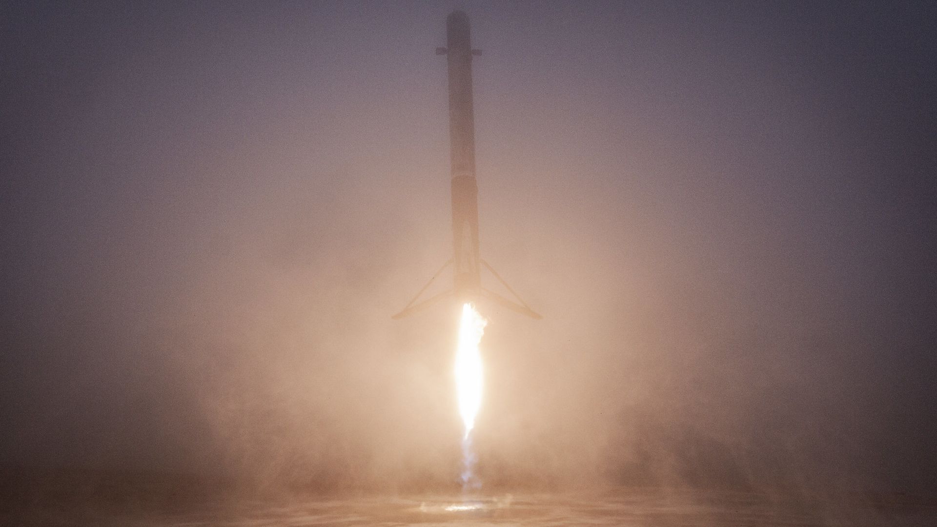 A SpaceX Falcon 9 rocket coming in for a landing.