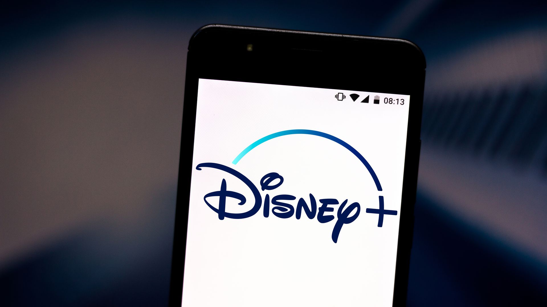 Photo of a smartphone with a Disney+ logo