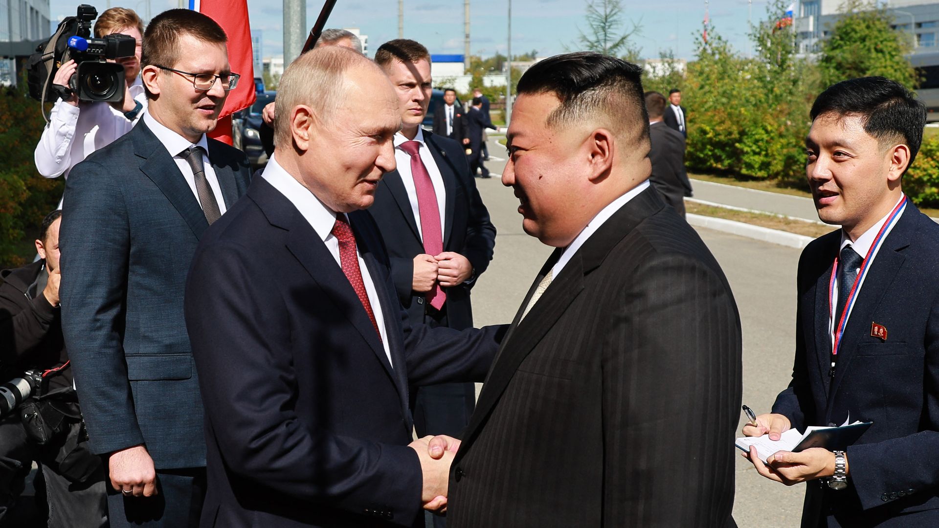 In this pool photo distributed by Sputnik agency, Russia's President Vladimir Putin (Centre L) shakes hands with North Korea's leader Kim Jong Un (2nd R) during their meeting at the Vostochny Cosmodrome in Amur region on September 13, 2023. 