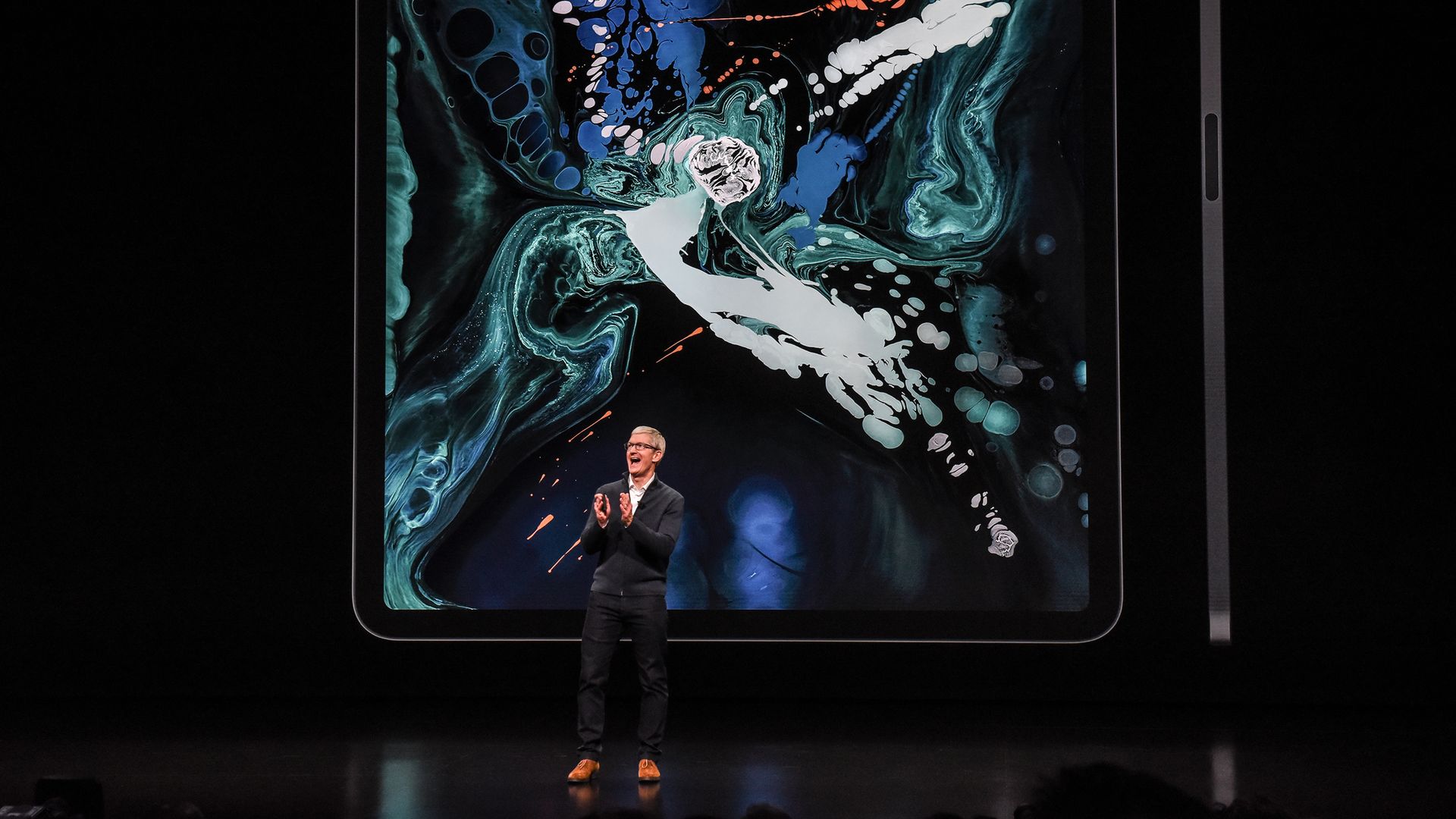 Apple CEO Tim Cook introducing products onstage.