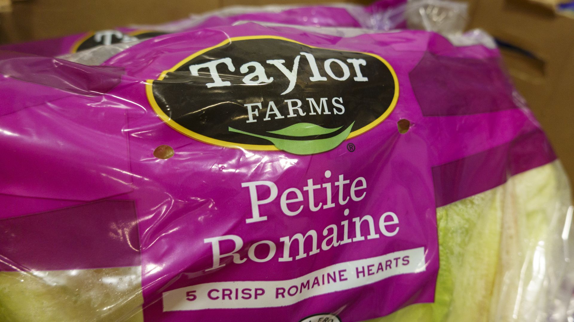 A plastic package of romaine hearts that says "taylor farms"