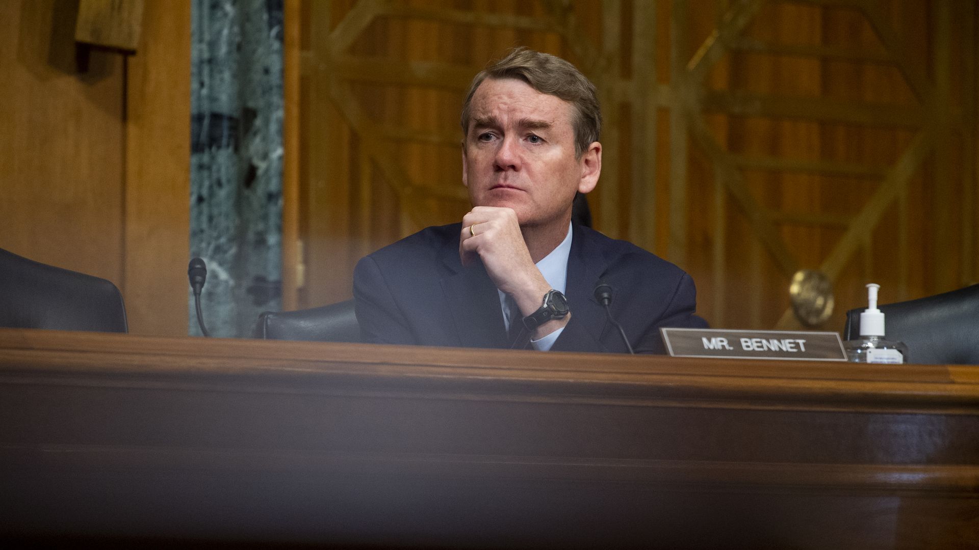 Sen. Michael Bennet is seen listening during a congressional hearing.