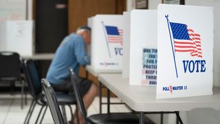 MT. GILEAD, NC - MAY 17: A man fills out a ballot at a voting booth on May 17, 2022 in Mt. Gilead, North Carolina. North Carolina is one of several states holding midterm primary elections. 