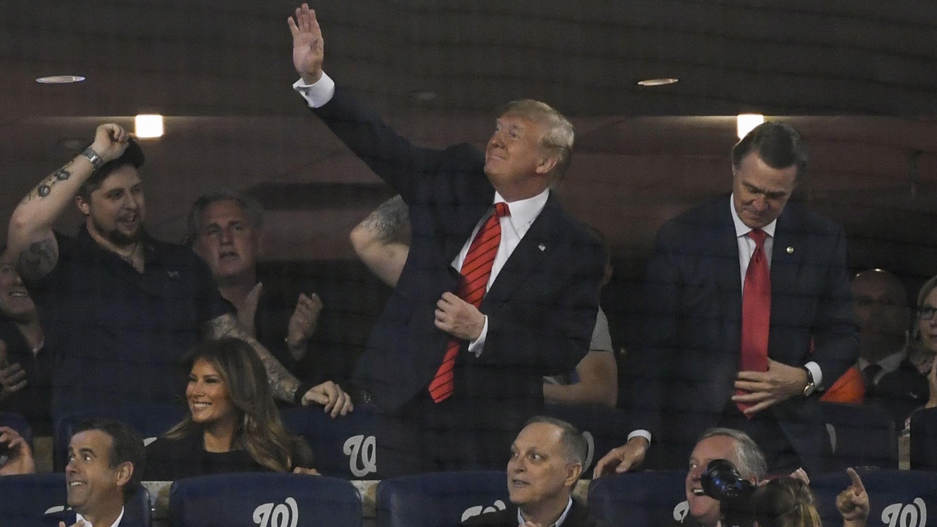 President Trump waves during Game 5 of the World Series as House Minority Leader Kevin McCarthy claps.