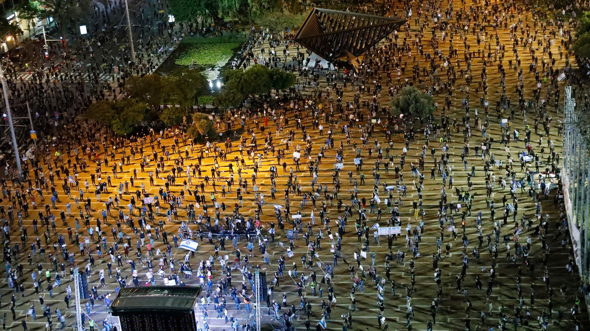 Masses of protestors all standing six feet from one another