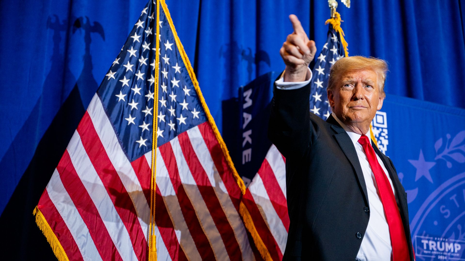 Republican presidential candidate, former U.S. President Donald Trump points to supporters at the conclusion of a campaign rally at the Atkinson Country Club on January 16, 2024 in Atkinson, New Hampshire.