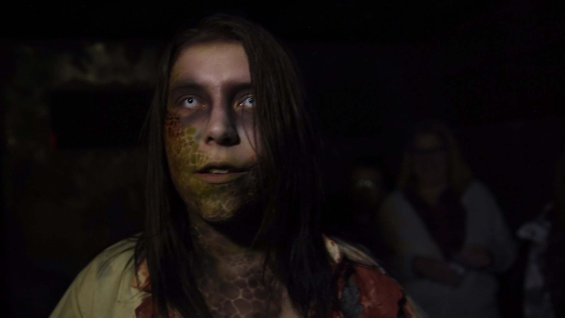 An actor leads you to the acton of the13th Floor Haunted House in Denver. Photo: Joe Amon/Denver Post via Getty Images