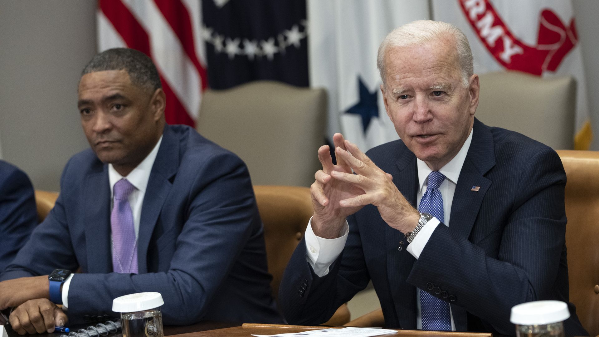 Cedric Richmond and Biden at a table.