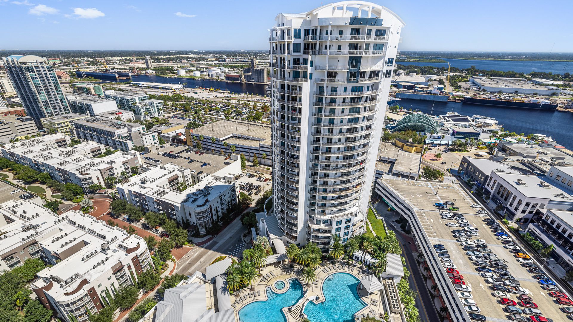 aerial view of the building and it's pools
