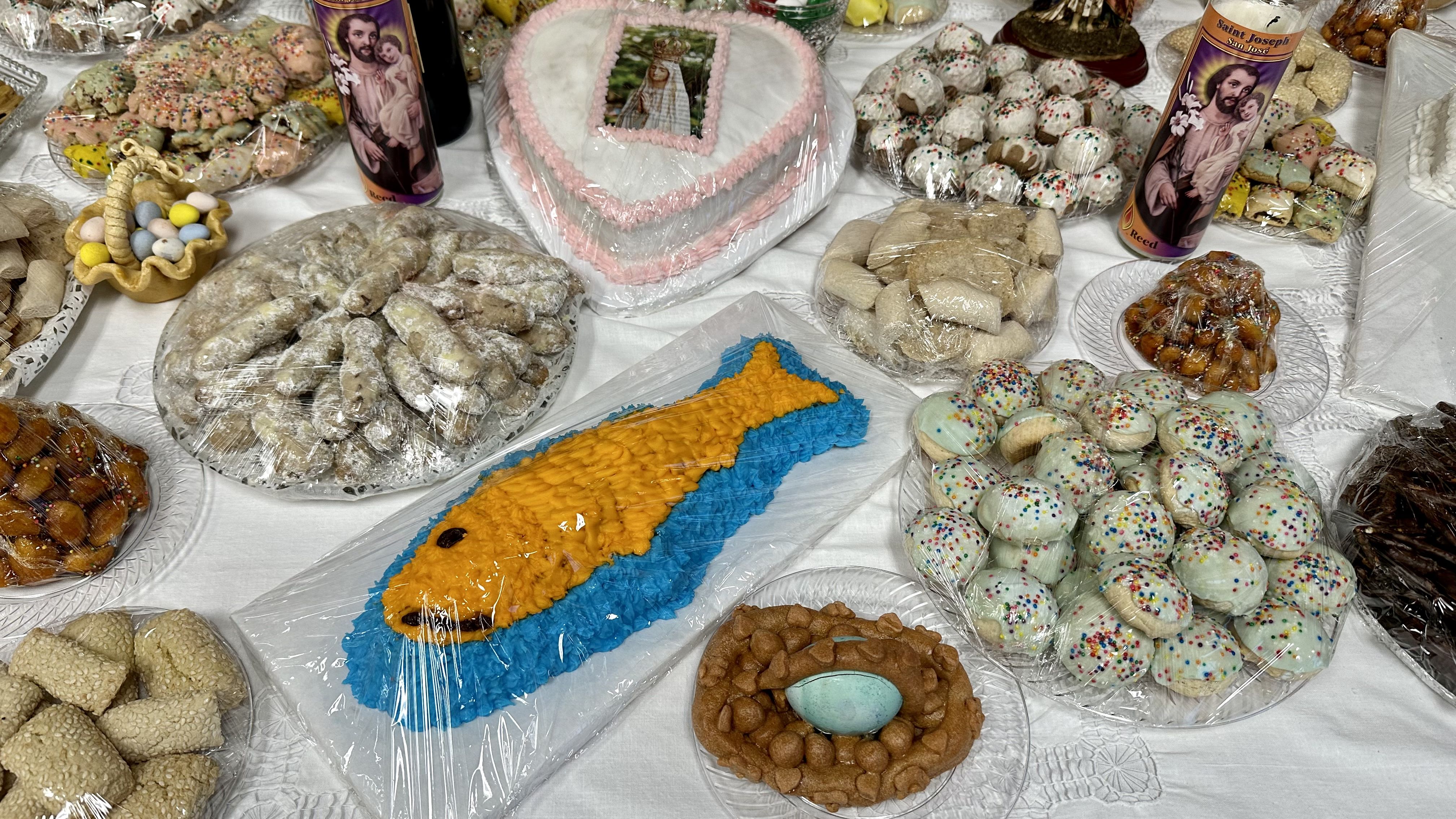 Photo shows a cake shaped into a fish.