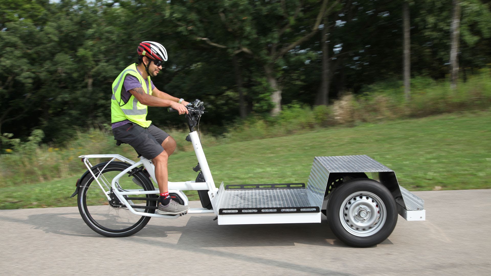 A worker in Madison, Wis., rides an e-cargo bike. Photo: Saris Infrastructure