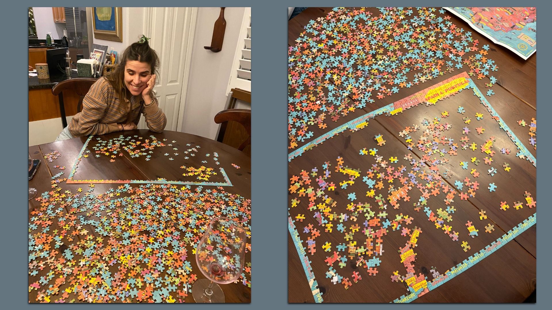 A woman with a striped brown shirt smiles while working on a colorful jigsaw puzzle spread out on a wooden table, with a wine glass nearby and puzzle pieces mostly sorted around an assembled border.