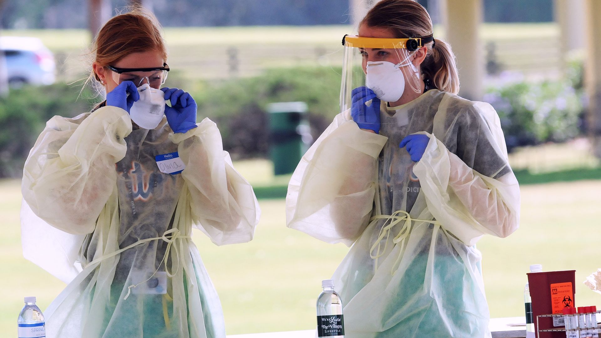 Health care workers wearing personal protection equipment.