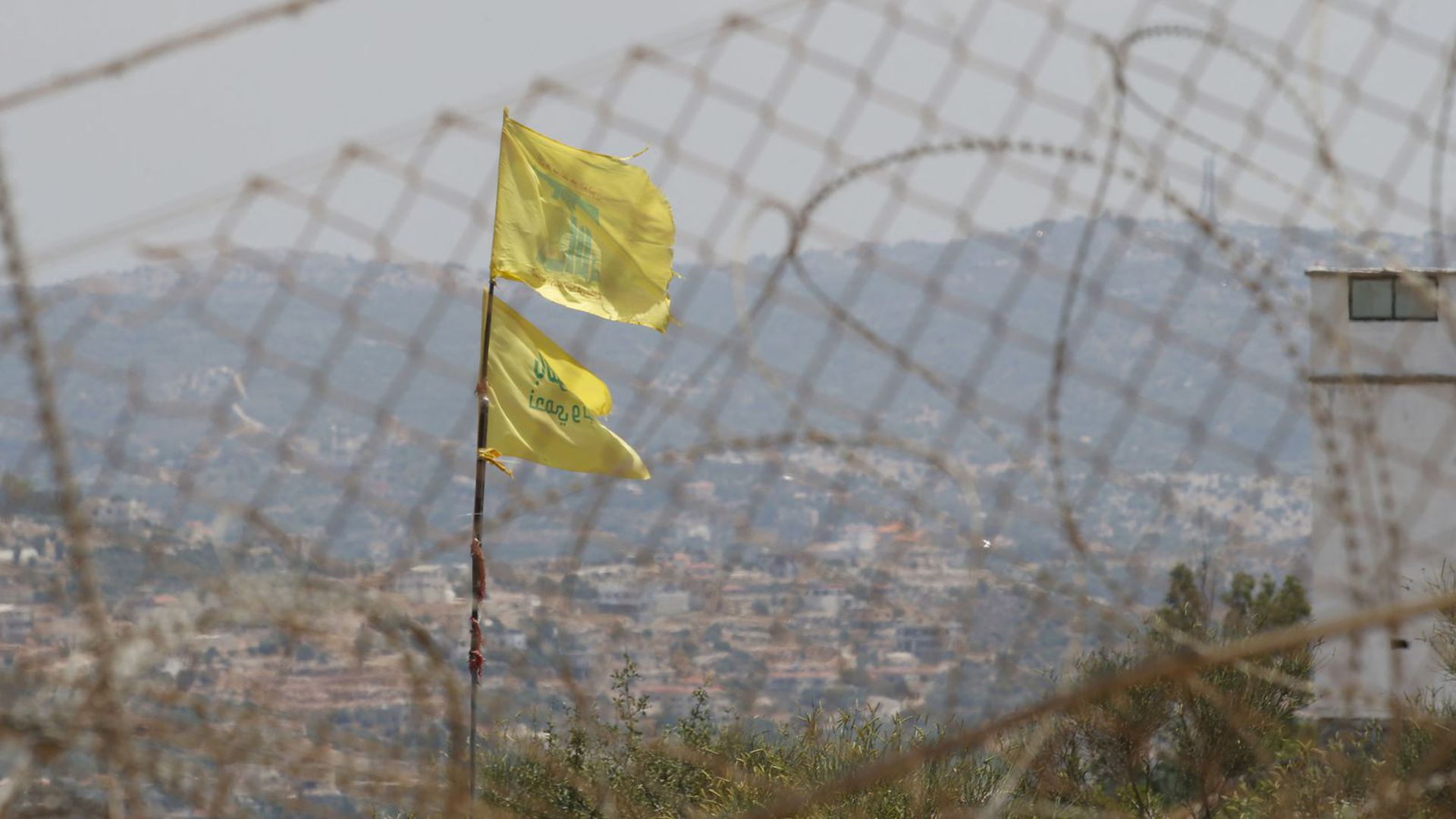 Hezbollah flags on the Lebanese side of the border with Israel. Photo: Jalaa Marey/AFP via Getty Images