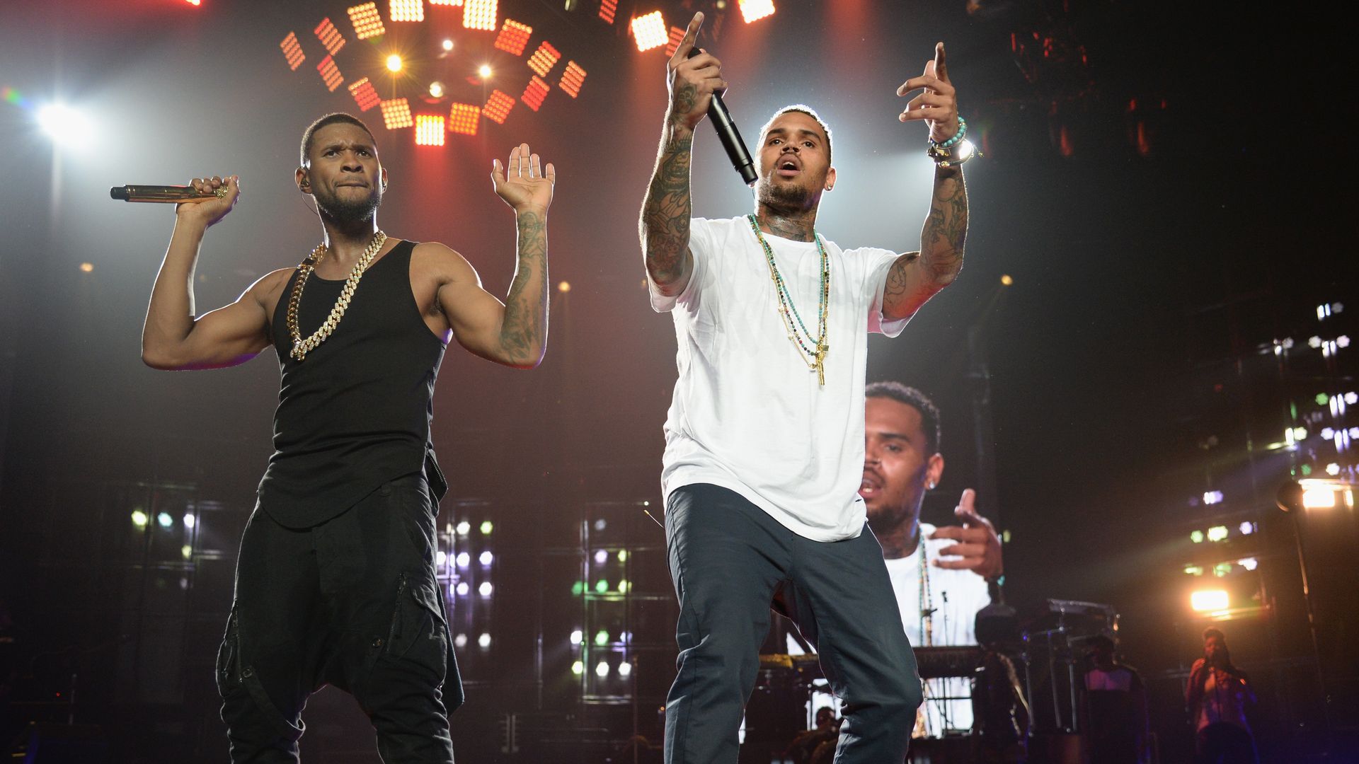 Usher and Chris Brown perform on stage