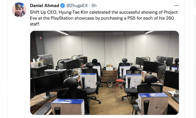 Screenshot of a tweet showing an office with boxed PS5s sitting on each worker's chair