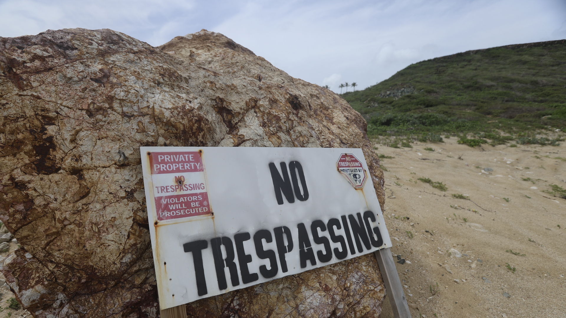 A "no trespassing" sign on the beach of Little Saint James. Photo: House Oversight Committee Democrats