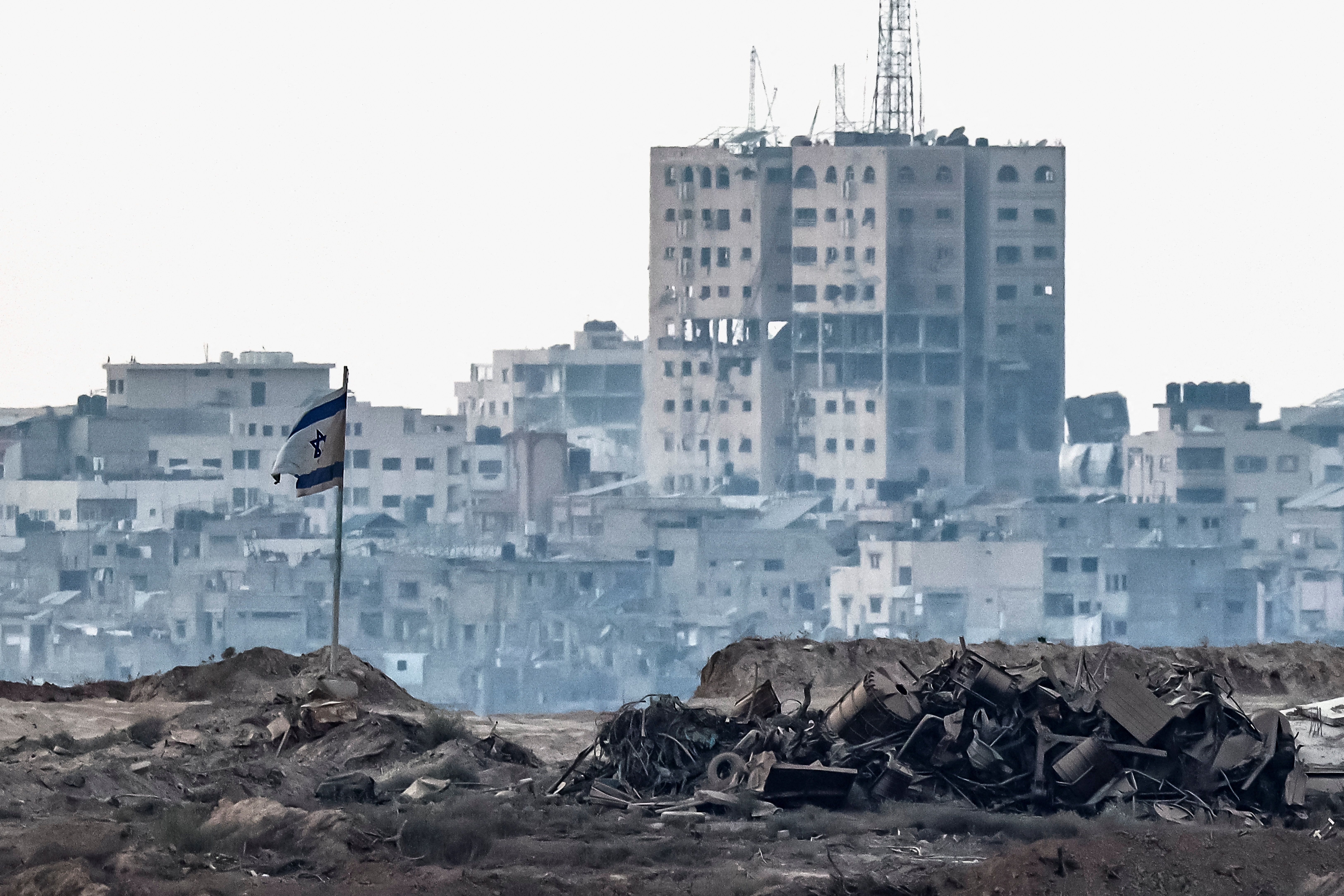 A damaged Israeli flag in Gaza, photographed from the Israeli side of the border.