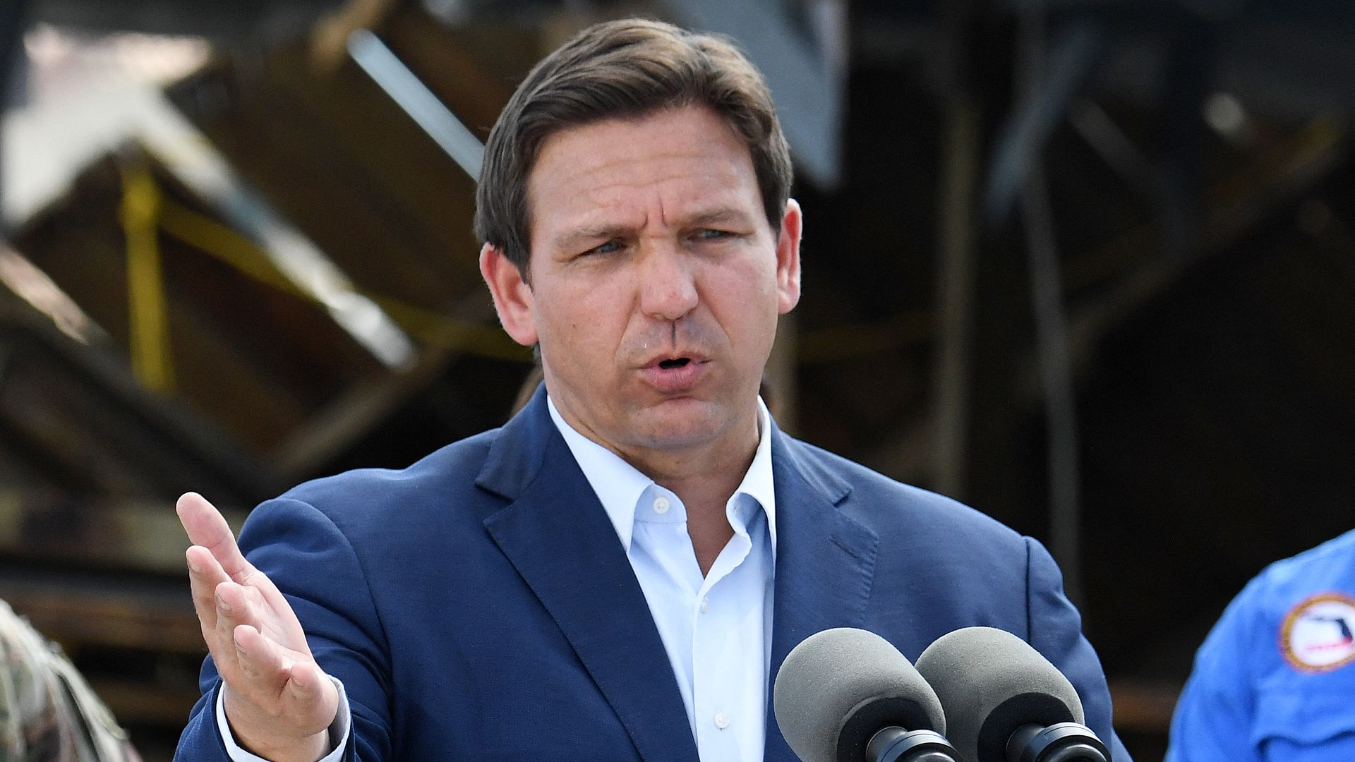Florida Governor Ron DeSantis speaks in a neighborhood impacted by Hurricane Ian at Fisherman's Wharf in Fort Myers, Florida, on October 5, 2022
