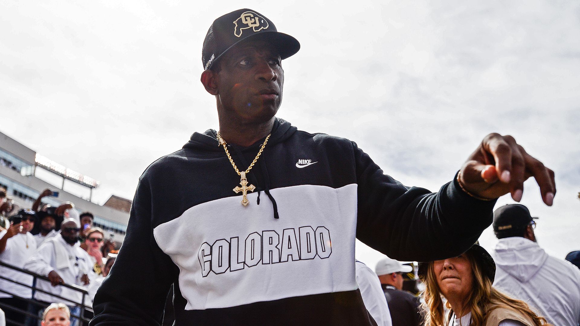 Head coach Deion Sanders of the Colorado Buffaloes walks off the field at halftime of a game against the USC Trojans at Folsom Field on September 30, 2023 in Boulder, Colorado. 
